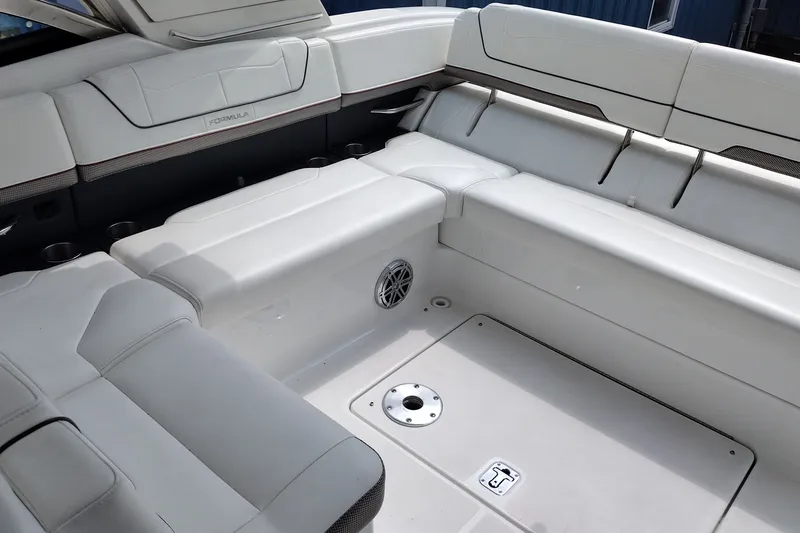 Slide: The Image of 2026 Formula 350 Crossover Bowrider interior with white seating and cup holders. - 27
