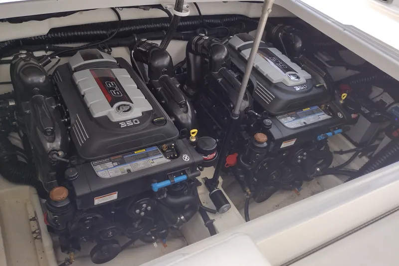 Slide: The Image of Twin engines in a 2026 Formula 350 Crossover Bowrider boat engine compartment. - 55