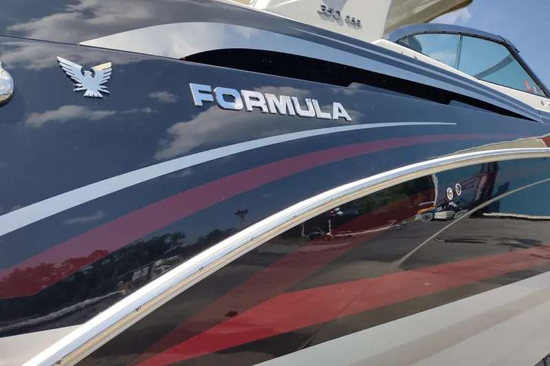 Slide: The Image of 2026 Formula 350 Crossover Bowrider boat with sleek design and logo detail. - 10