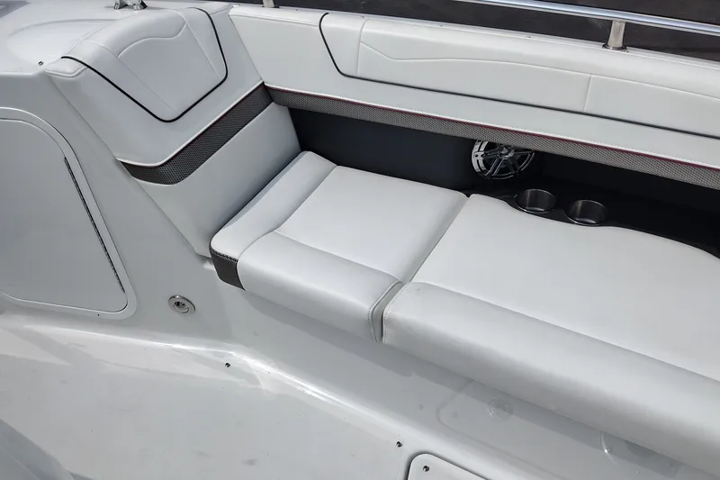 Slide: The Image of 2026 Formula 350 Crossover Bowrider interior seating with cup holders and speaker. - 19