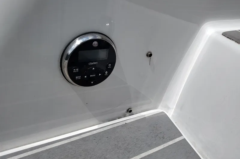 Slide: The Image of 2026 Formula 350 Crossover Bowrider audio control panel on sleek interior surface. - 63