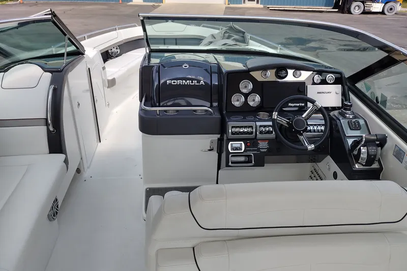 Slide: The Image of 2026 Formula 350 Crossover Bowrider cockpit with modern controls and luxurious seating. - 24