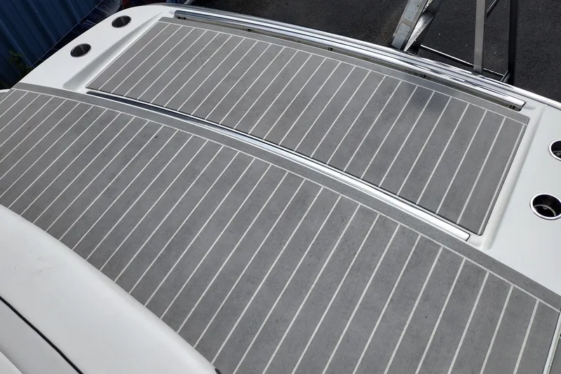 Slide: The Image of 2026 Formula 350 Crossover Bowrider swim platform with gray decking and stainless steel accents. - 71