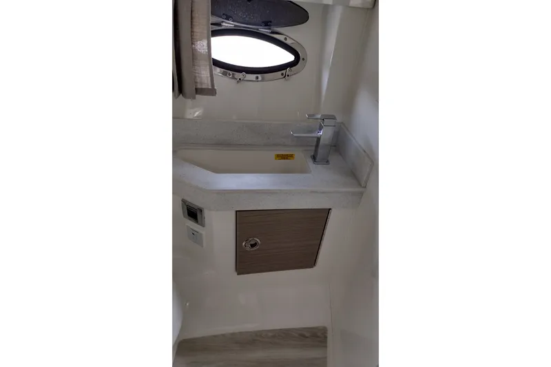 Slide: The Image of Interior of 2026 Formula 350 Crossover Bowrider featuring a modern sink and porthole window. - 40