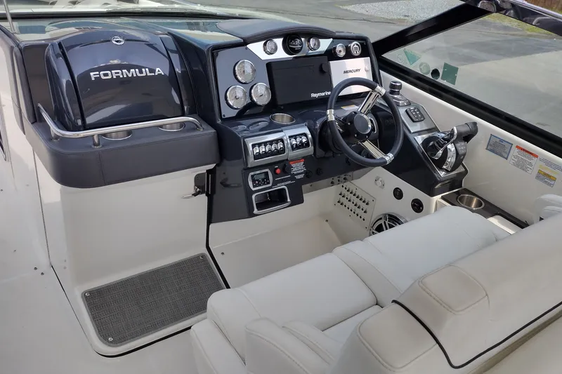 Slide: The Image of 2026 Formula 350 Crossover Bowrider cockpit with modern controls and luxurious seating. - 22