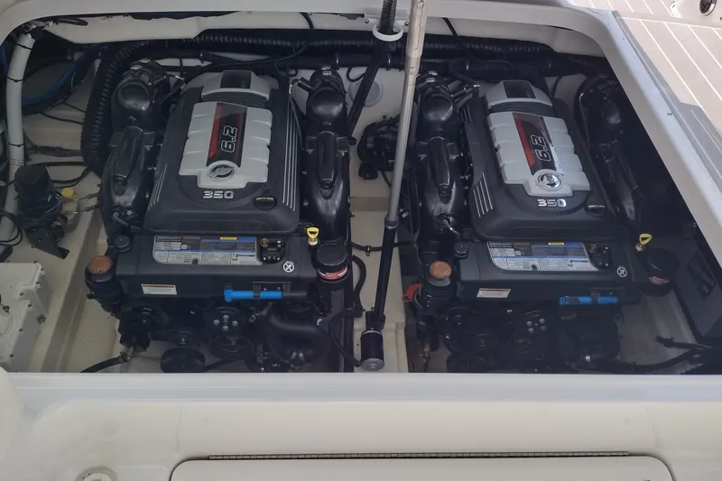 Slide: The Image of Twin engines in a 2026 Formula 350 Crossover Bowrider boat engine compartment. - 54