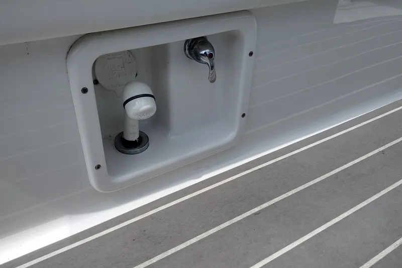 Slide: The Image of 2026 Formula 350 Crossover Bowrider washdown system on deck. - 64