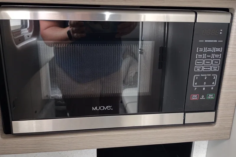 Slide: The Image of Microwave oven in a 2026 Formula 350 Crossover Bowrider boat kitchen. - 49