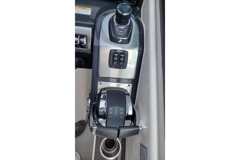 Slide: The Image of Control panel of 2026 Formula 350 Crossover Bowrider boat, featuring modern joystick and throttle. - 36