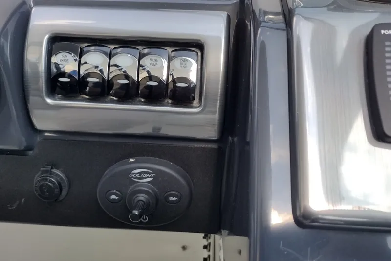 Slide: The Image of Control panel of 2026 Formula 350 Crossover Bowrider with switches and Golight control. - 33