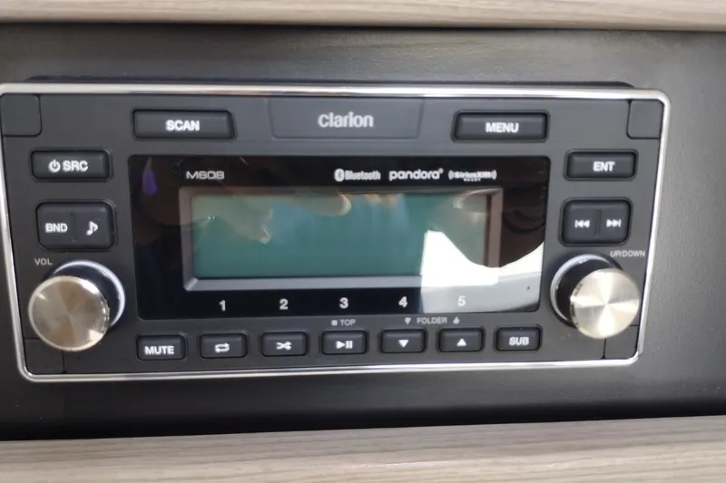 Slide: The Image of Clarion audio system in 2026 Formula 350 Crossover Bowrider, featuring Bluetooth and Pandora connectivity. - 43