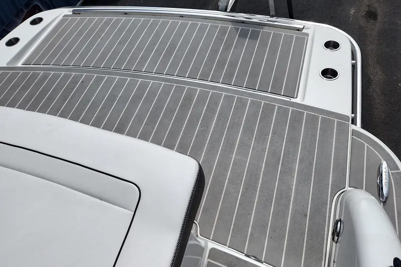 Slide: The Image of 2026 Formula 350 Crossover Bowrider deck with sleek, modern design and gray flooring. - 70