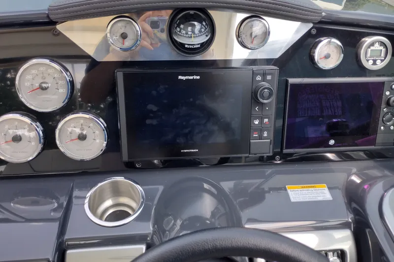 Slide: The Image of Dashboard of 2026 Formula 350 Crossover Bowrider with navigation and gauges. - 31