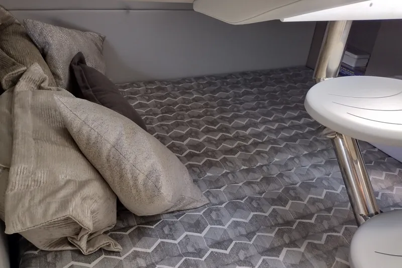 Slide: The Image of Interior cabin of 2026 Formula 350 Crossover Bowrider with patterned bedding and cushions. - 45