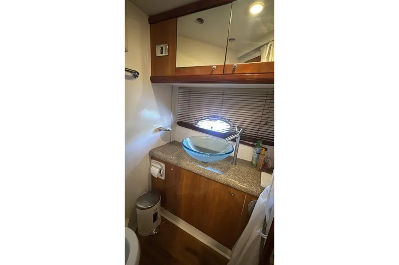 Slide: The Image of Bathroom interior of 2003 Sunseeker Portofino 46 yacht with modern glass sink. - 23