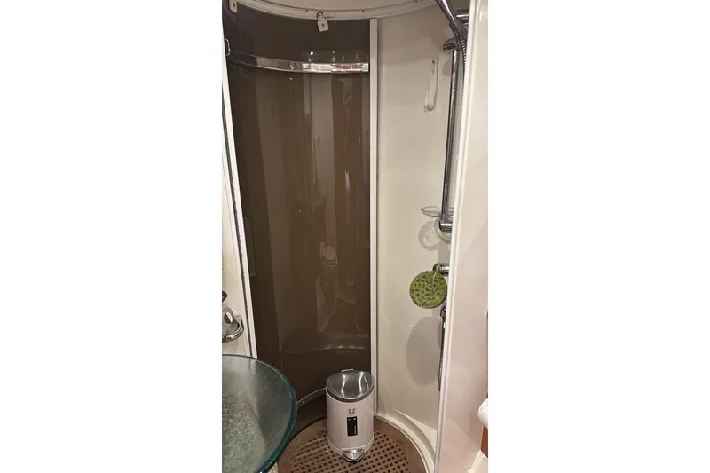 Slide: The Image of Shower area in 2003 Sunseeker Portofino 46 yacht, featuring modern fixtures and glass basin. - 16