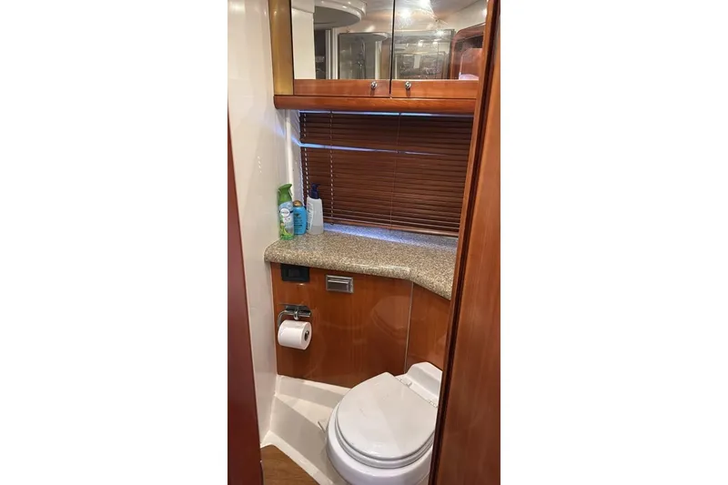 Slide: The Image of Luxurious bathroom in 2003 Sunseeker Portofino 46 yacht with wooden cabinetry. - 14