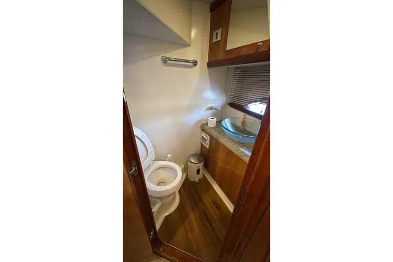 Slide: The Image of Bathroom interior of 2003 Sunseeker Portofino 46 yacht, featuring toilet and sink. - 22