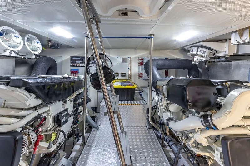 Slide: The Image of Engine room of 2023 Sirena Flybridge yacht, featuring advanced machinery and equipment. - 58