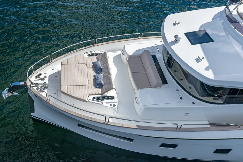 Slide: The Image of 2023 Sirena Flybridge yacht with spacious deck and luxurious seating on water. - 9
