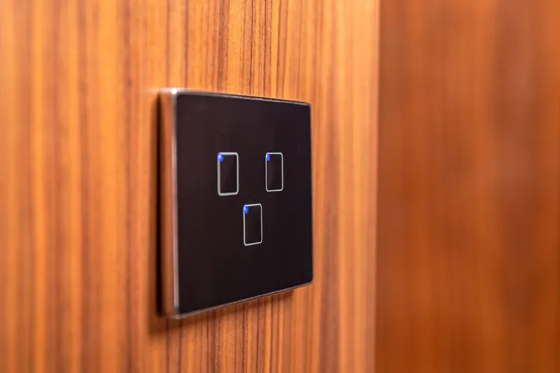 Slide: The Image of Modern light switch on Sirena Flybridge 2023 yacht with wooden paneling. - 41