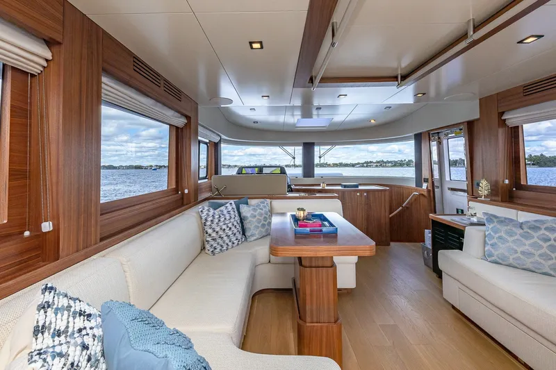 Slide: The Image of Luxurious interior of 2023 Sirena Flybridge yacht with elegant wood finishes and scenic water views. - 36