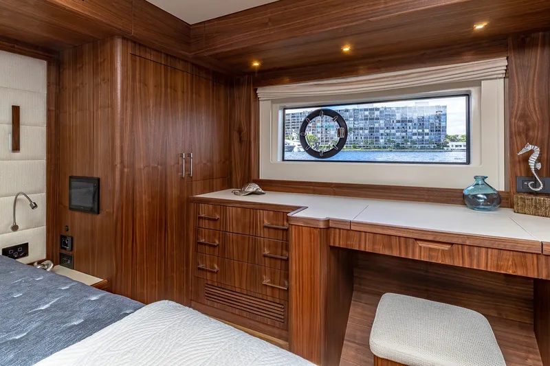 Slide: The Image of Luxurious 2023 Sirena Flybridge yacht interior with wooden cabinetry and waterfront view. - 46