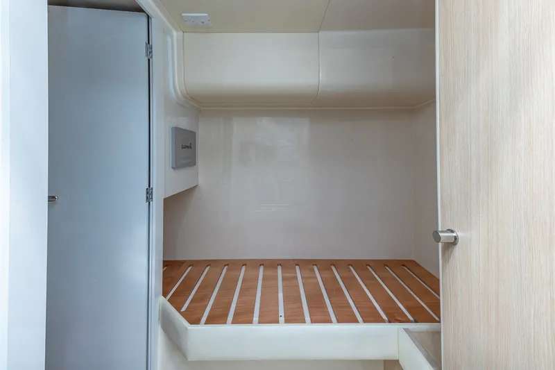 Slide: The Image of 2023 Sirena Flybridge interior cabin with wooden flooring and modern design. - 63