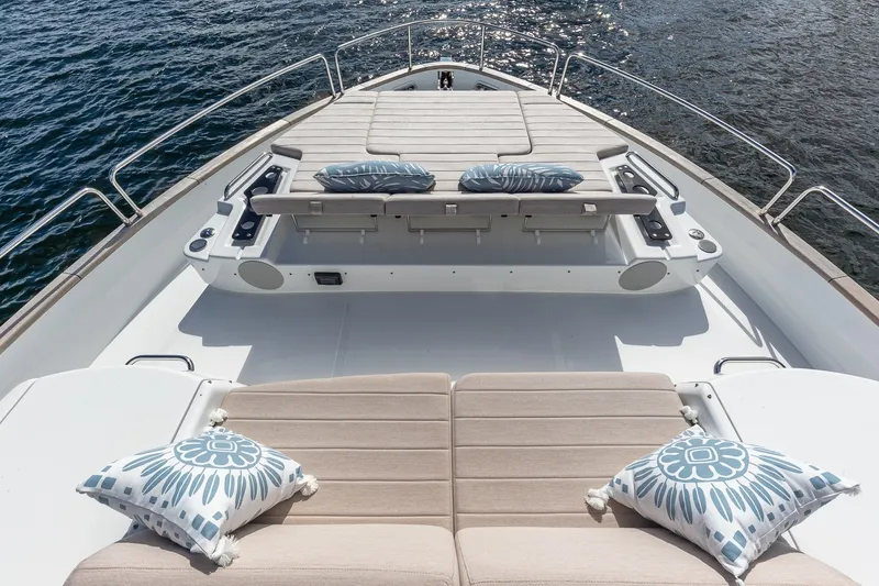 Slide: The Image of Luxurious 2023 Sirena Flybridge yacht deck with plush seating and decorative cushions. - 19