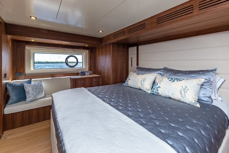 Slide: The Image of Luxurious 2023 Sirena Flybridge yacht bedroom with elegant wood finish and ocean view. - 45
