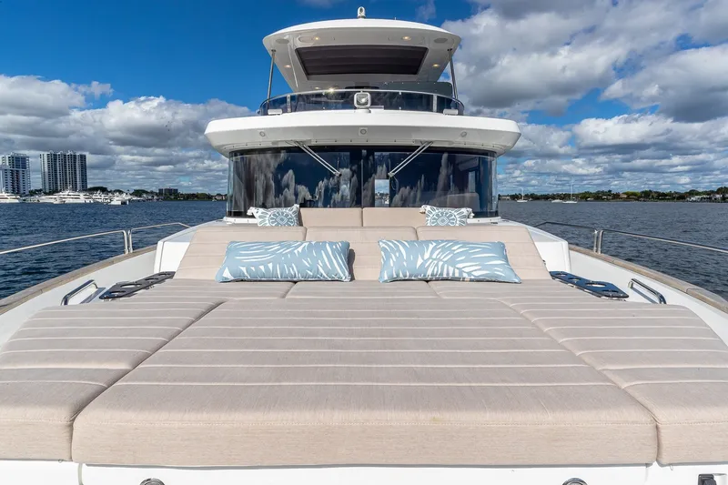 Slide: The Image of 2023 Sirena Flybridge yacht with spacious sun deck and scenic waterfront view. - 21