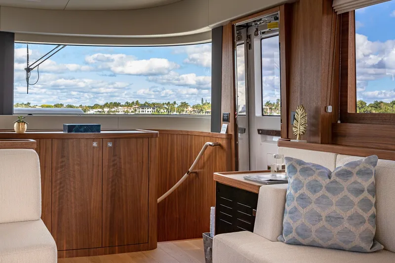 Slide: The Image of Luxurious interior of 2023 Sirena Flybridge yacht with elegant wood finishes and scenic views. - 39