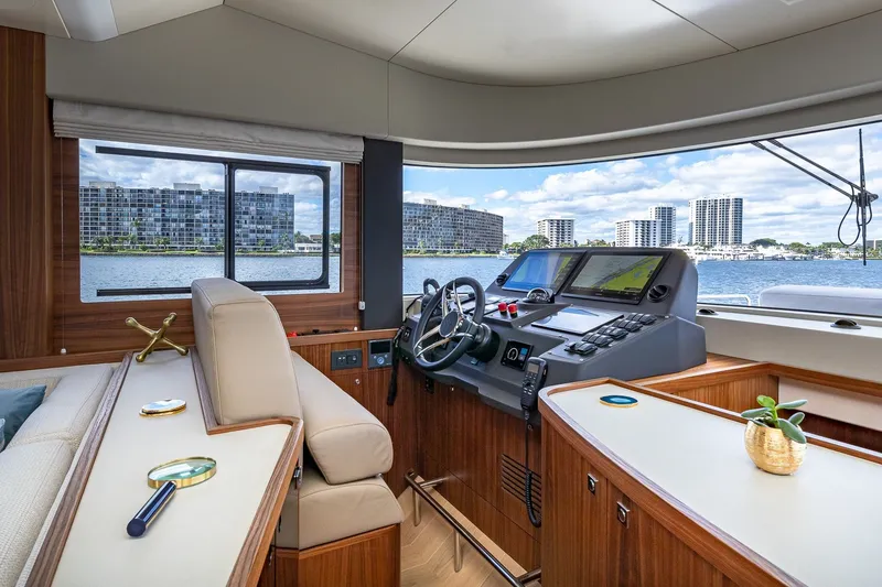 Slide: The Image of Luxurious 2023 Sirena Flybridge yacht interior with modern helm and waterfront view. - 37