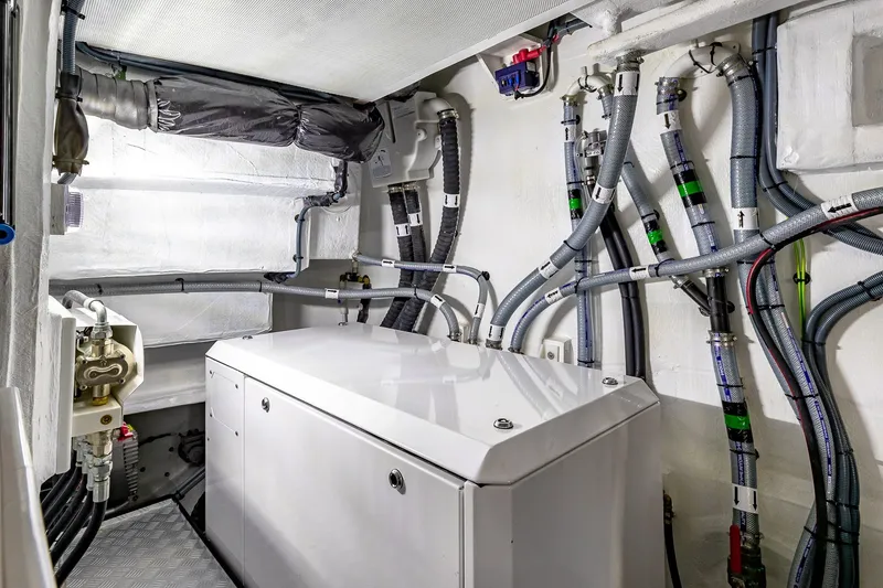 Slide: The Image of Engine room of 2023 Sirena Flybridge yacht with cables and machinery. - 62