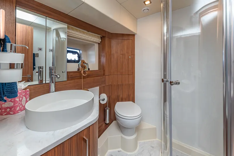 Slide: The Image of Luxurious 2023 Sirena Flybridge yacht bathroom with modern fixtures and elegant wood accents. - 53