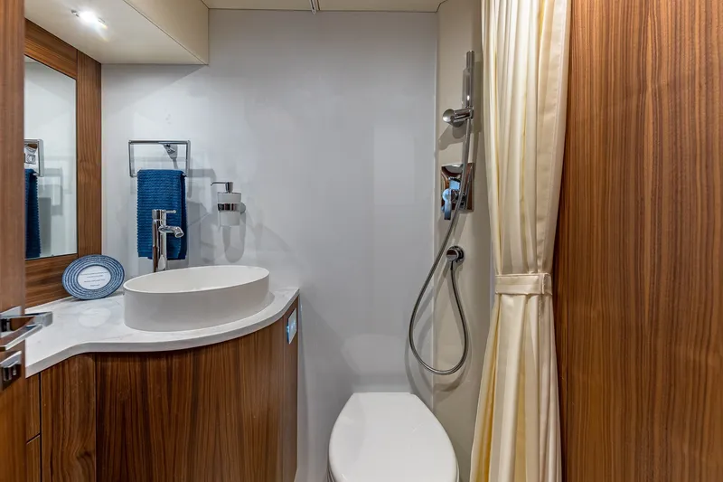Slide: The Image of Luxurious 2023 Sirena Flybridge yacht bathroom with modern fixtures and elegant wood accents. - 57