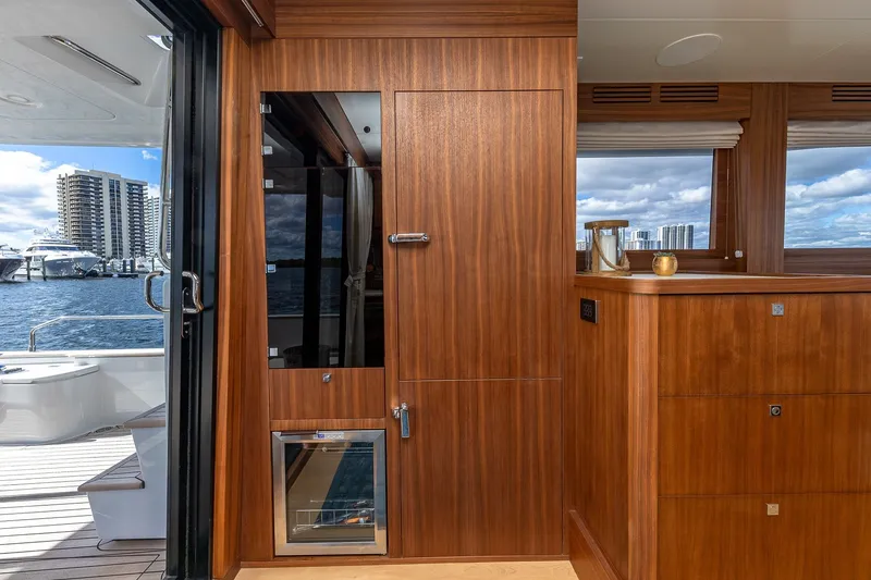 Slide: The Image of Luxurious interior of 2023 Sirena Flybridge yacht with wooden cabinetry and waterfront view. - 34