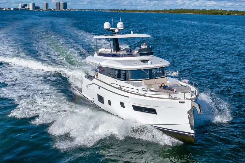 Slide: The Image of 2023 Sirena Flybridge yacht cruising on open water, showcasing luxury and elegance. - 3