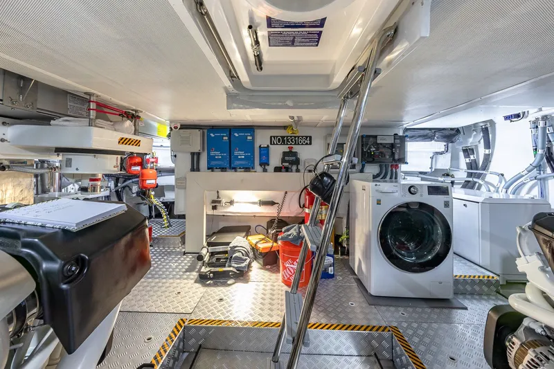 Slide: The Image of Engine room of 2023 Sirena Flybridge yacht with equipment and washing machine. - 59
