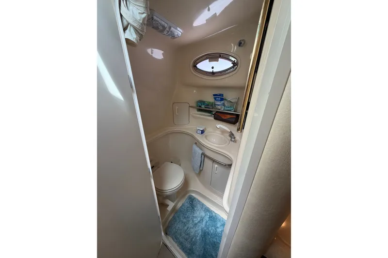 Slide: The Image of Bathroom interior of 2000 Sea Ray 340 Sundancer yacht, featuring compact design and amenities. - 19