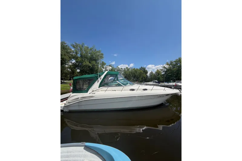 The Image of 2000 Sea Ray 340 Sundancer boat docked on a sunny day with clear skies. - 0