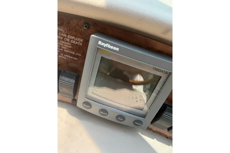 Slide: The Image of Raytheon ST60 Tridata display on 2000 Sea Ray 340 Sundancer boat dashboard. - 13