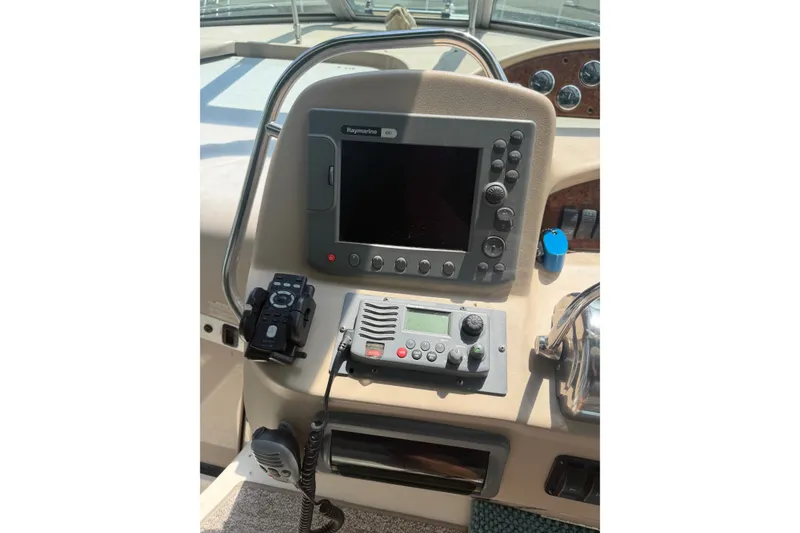 Slide: The Image of Control panel of a 2000 Sea Ray 340 Sundancer boat with navigation equipment. - 12