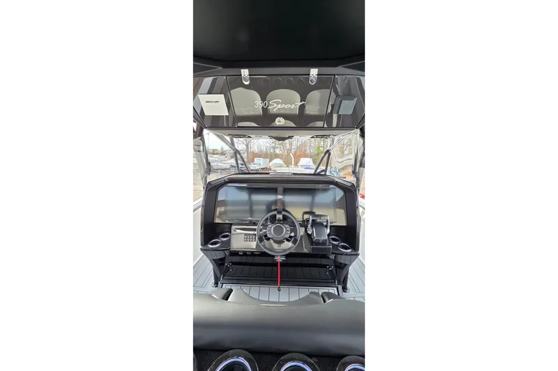 Slide: The Image of 2026 Nor-Tech 390 Sport Center Console dashboard with steering wheel and controls. - 3