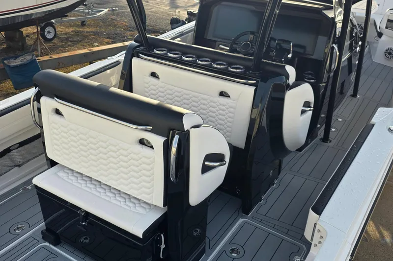 Slide: The Image of 2026 Nor-Tech 390 Sport Center Console with luxurious seating and modern dashboard design. - 8