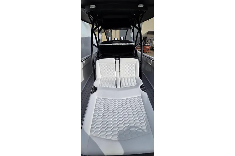 Slide: The Image of 2026 Nor-Tech 390 Sport Center Console interior with white quilted seating. - 12