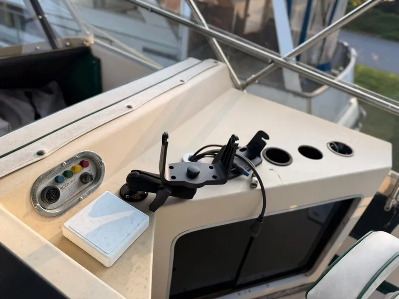 Slide: The Image of The image shows the cockpit of a 1981 Sea Ray 360 Sportfish with controls and instruments. - 18