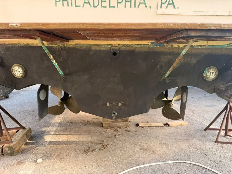 Slide: The Image of The hull of a 1981 Sea Ray 360 Sportfish with dual propellers and supports. - 44