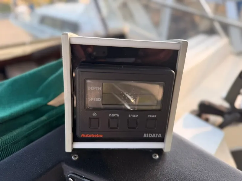 Slide: The Image of An Autohlem Bidata device displaying depth and speed, mounted on a boat. - 42