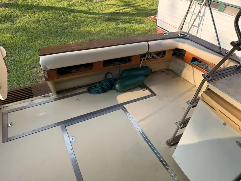 Slide: The Image of The image shows the cockpit of a 1981 Sea Ray 360 Sportfish with seating and storage. - 43